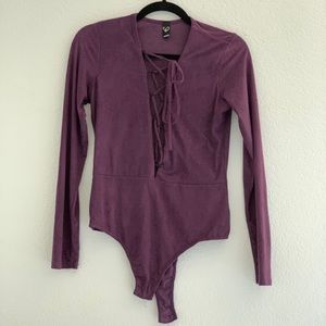 95% Polyester 5% spandex purple body suite size L